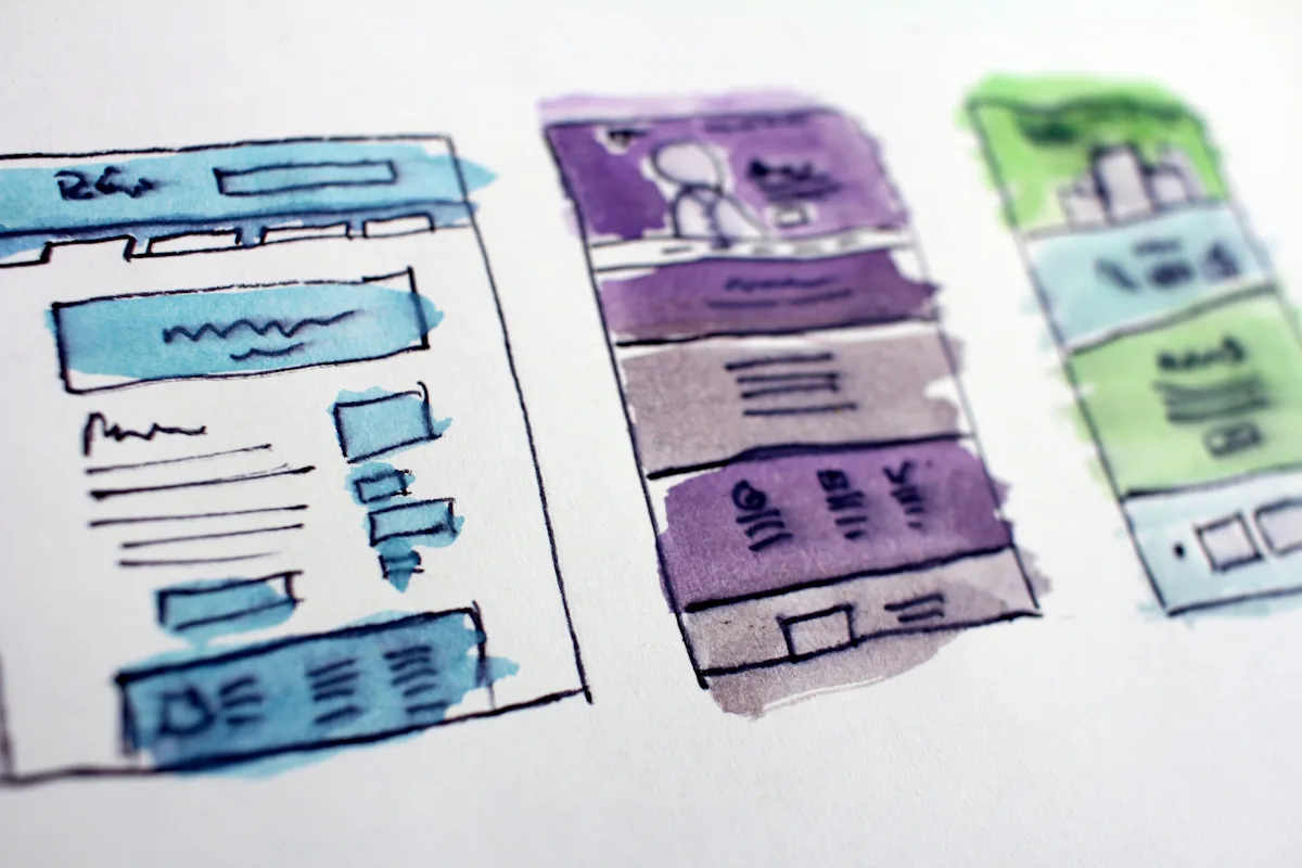 Wireframe sketches of website layouts, the planning stage of building your own website. Photo by Hal Gatewood on Unsplash.