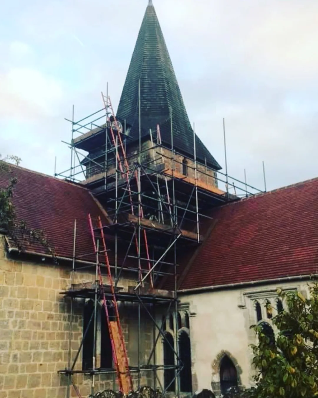 Alt Text Bespoke scaffolding erected around a church spire for restoration works by A-Star Scaffolding Southern Ltd, West Sussex