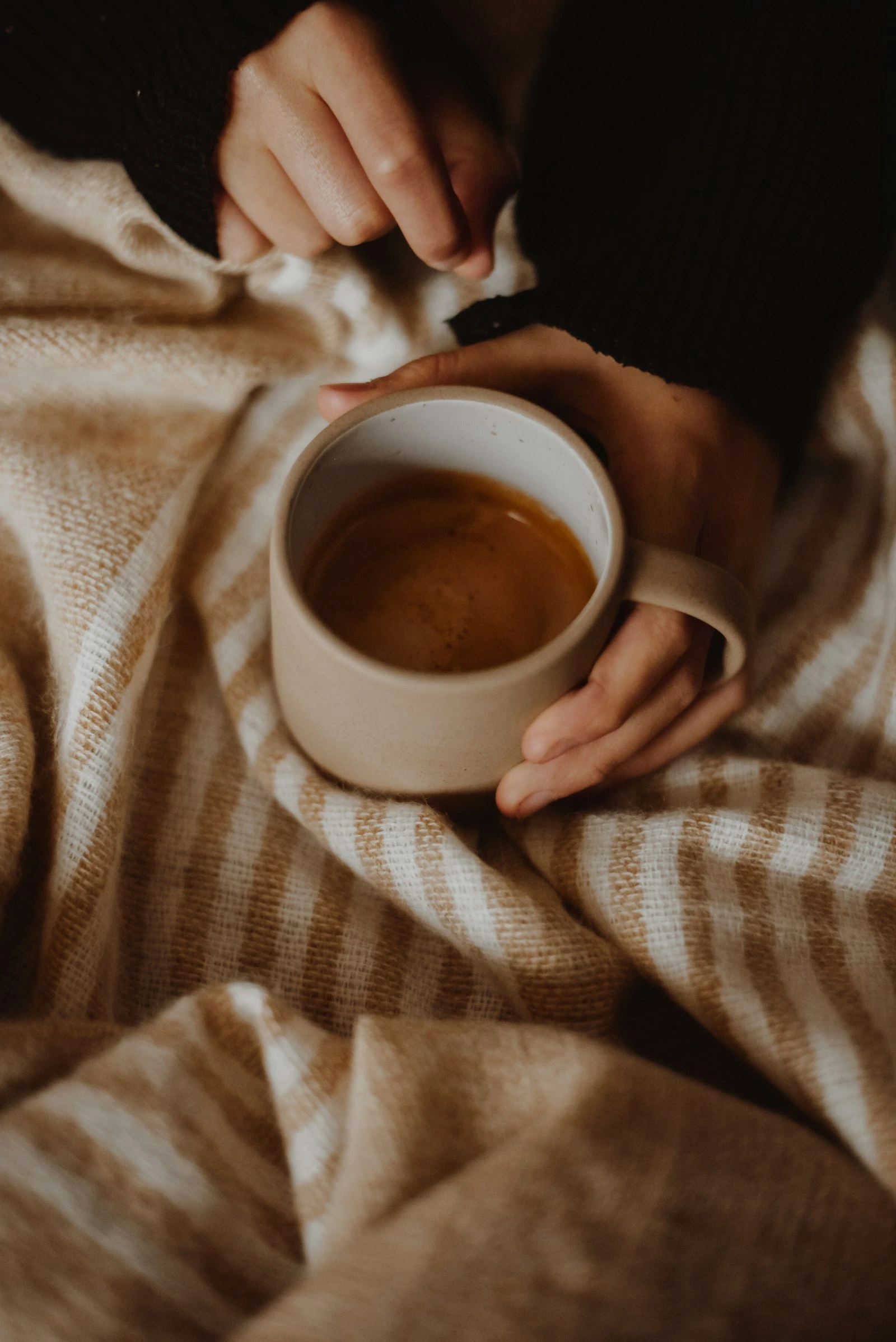 Warm cup of coffee toasty and warm at Novauria Aesthetics