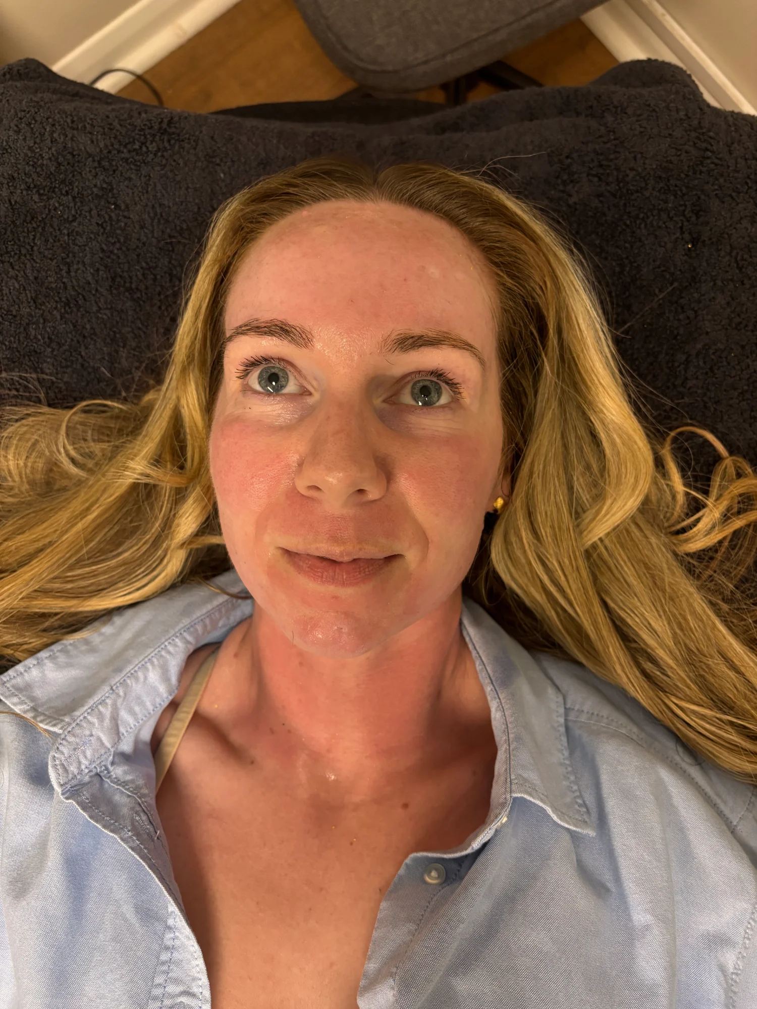 Client relaxing on the treatment bed before her aesthetic treatment at Novauria Aesthetics