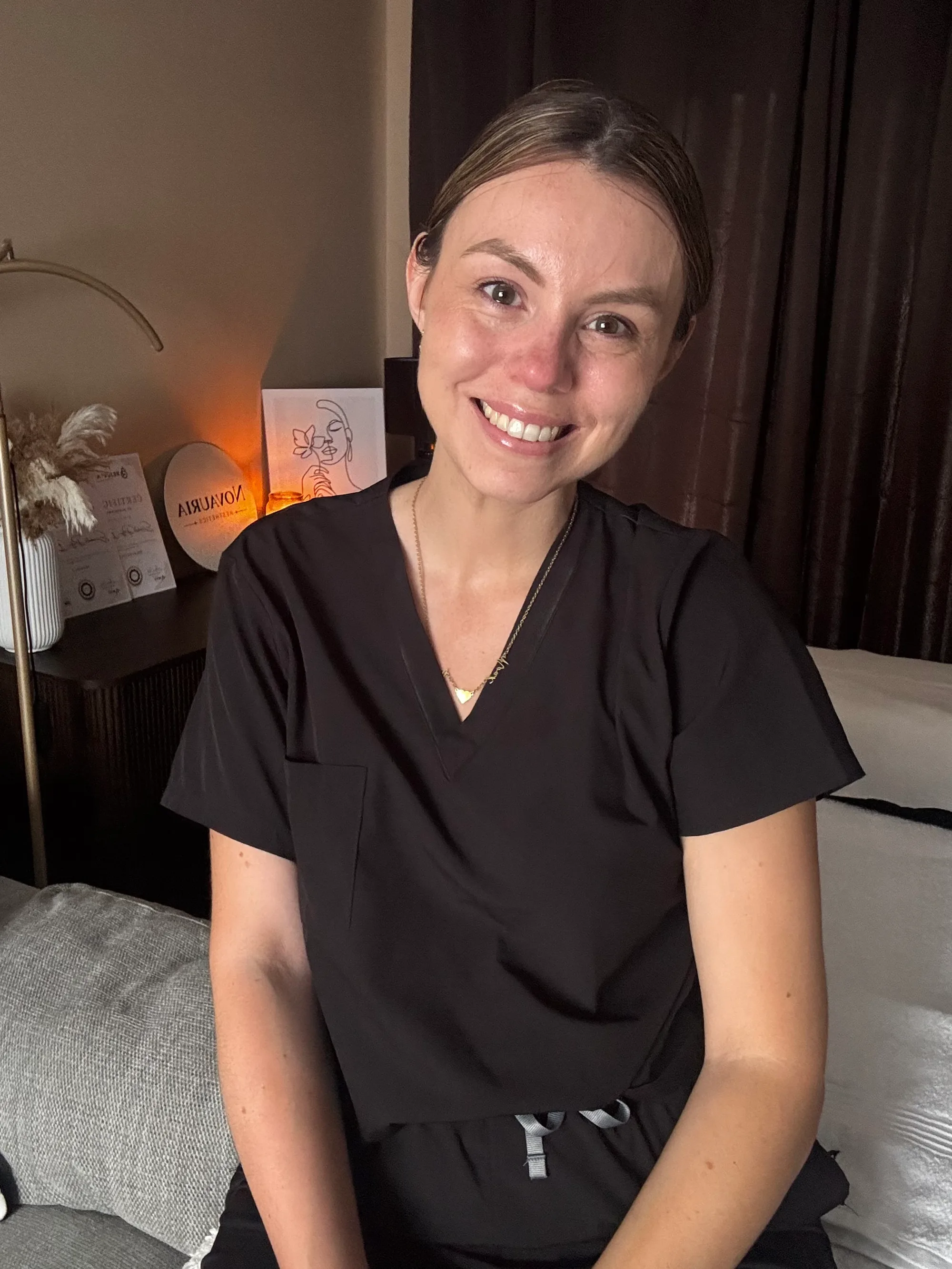 Liz, founder of Novauria Aesthetics, smiling in her Ashford treatment room